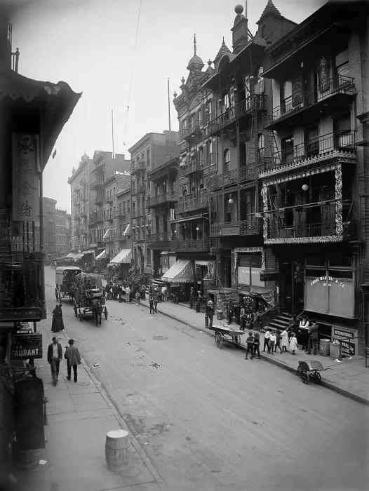 Framed Print : Mott Street in New York City's Chinatown presents a cosmopolitan scene mixing Asian and American-European dress and faces