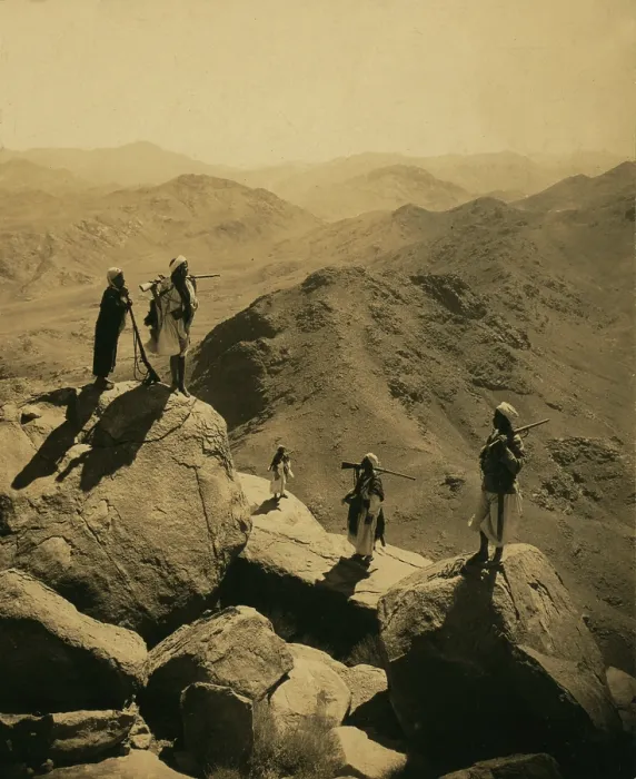Framed Print : Mount Sinai, men with rifles standing on boulders looking out over valley and mountains, south by West, from the summit of Mount Catherine Framed Print : Mount Sinai, men with rifles standing on boulders looking out over valley and mountains, south by West, from the summit of Mount Catherine