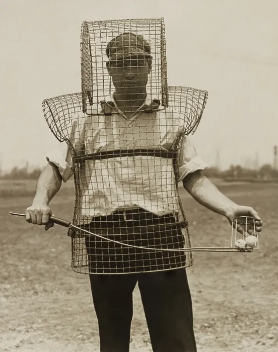 Framed Print : Mouse-trap armor is the newest safety device seen on California golf courses in 1920s Framed Print : Mouse-trap armor is the newest safety device seen on California golf courses in 1920s