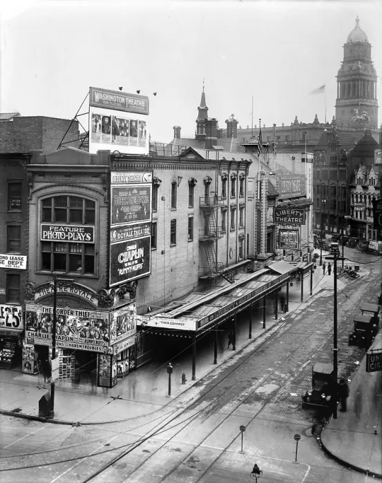 Framed Print : Movie Theaters, the Theatre Royale (left), playing THEIR COMPACT, and the Charles Chaplin film THE FALL OF THE RUMMY-NUFFS, and the Liberty Theatre (back right)