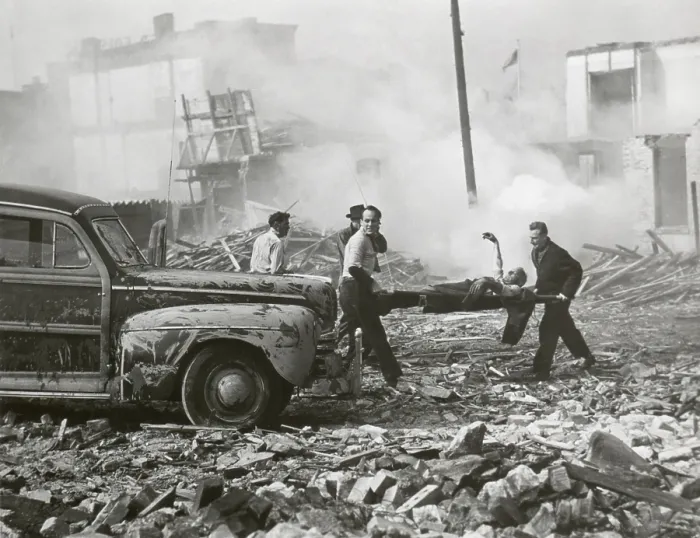 Framed Print : Movie still from a U.S. Army film about a hypothetical attack using an atomic bomb, Nov. 1948. Still shows rescue workers are shown removing the injured from shattered homes