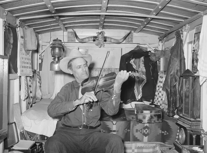 Framed Print : Mr. Bias playing the fiddle in his trailer home. He is a former cowboy who travels the country living on a small private income. Weslaco, Texas. Feb. 1930 (BSLOC_2015_14_145)