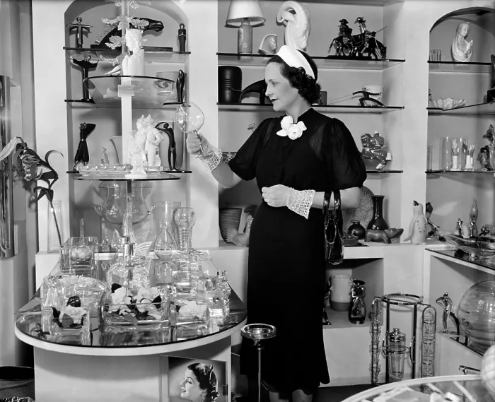 Framed Print : Mrs. Claude Pepper wife of the Democratic Senator from Florida admiring a glass in a shop on Connecticut Avenue. July 27 1937. (BSLOC_2010_18_112)