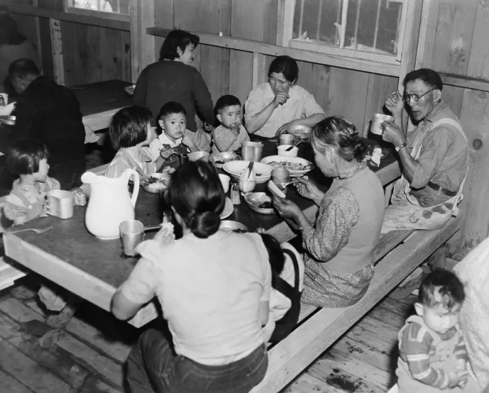 Framed Print : Multiple generations of Japanese Americans at meal time in the Manzanar Internment Camp barracks dining area