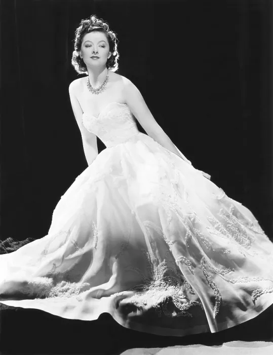 Framed Print : Myrna Loy in a white souffle evening gown with a diamond and silver necklace in a starfish pattern, MGM portrait, circa 1940 Framed Print : Myrna Loy in a white souffle evening gown with a diamond and silver necklace in a starfish pattern, MGM portrait, circa 1940