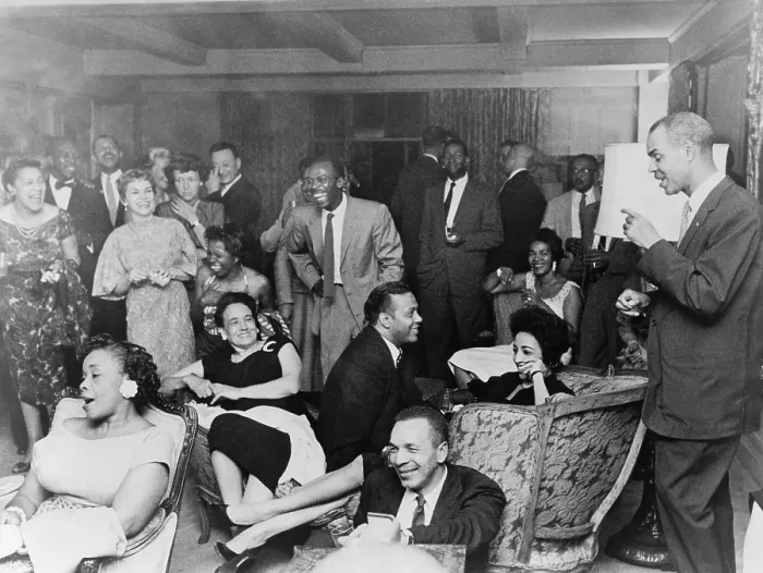 Framed Print : NAACP members at fashionable social gathering, with executive secretary Roy Wilkins standing on the right. Ca. 1960