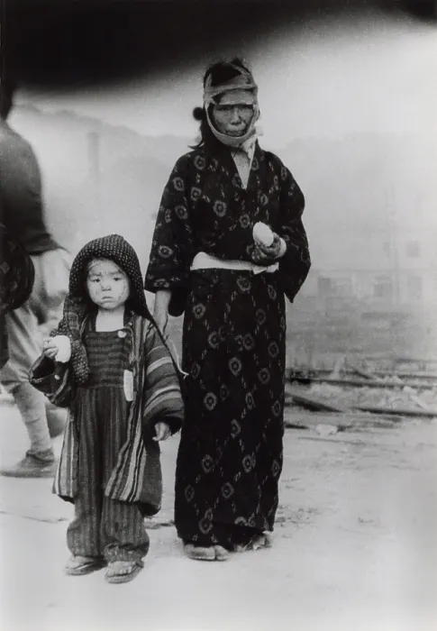 Framed Print : Nagasaki atomic bomb survivors holding boiled rice balls distributed by emergency workers