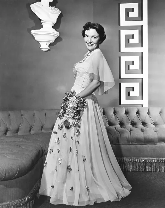 Framed Print : Nancy Davis, (aka Nancy Reagan), modeling a lavendar nylon gown with rhinestone-spangled flowers, 1950