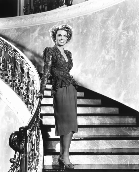 Framed Print : Natalie Schafer, modeling a cocktail suit of gray lace and crepe, 1944