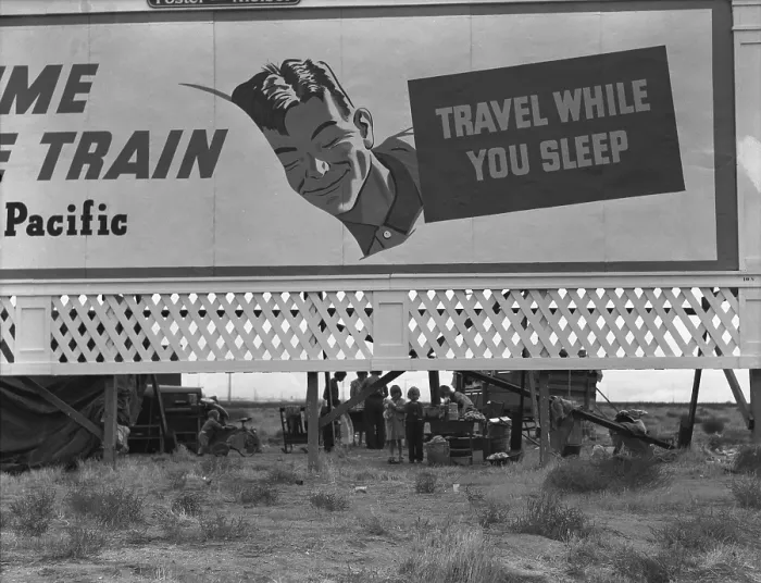 Framed Print : National Association of Manufacturers optimistic billboard on U.S. 99 shelters three homeless and destitute families of migrant laborers. Kern County, California