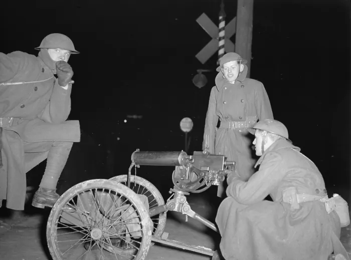 Framed Print : National Guard with machine gun overlooking GM factories. 1937