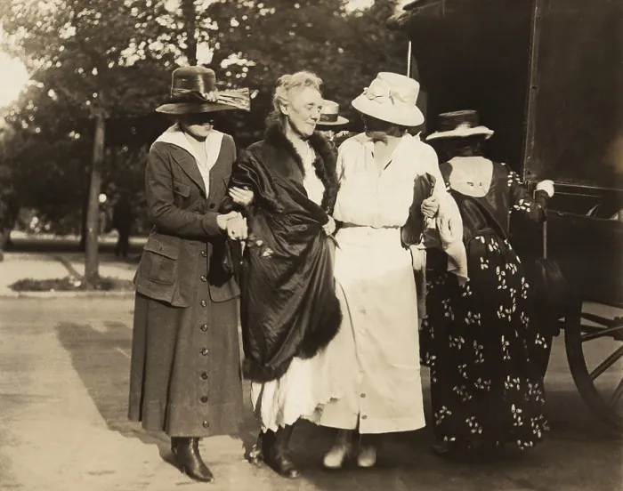 Framed Print : National Woman's Party activist, the elderly Dora Lewis, wrapped in blanket, is supported after release the Washington, D.C