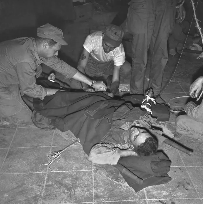 Framed Print : Navy corpsman gives a wounded U.S. Marine blood plasma at Yellow Beach Inchon, Korea. Sept. 19, 1950