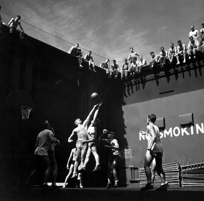Framed Print : Navy pilots playing basketball in elevator well of USS MONTEREY during World War 2. Jumper at left is future U.S. President, Gerald R. Ford. Mid-1944 in the Pacific Ocean