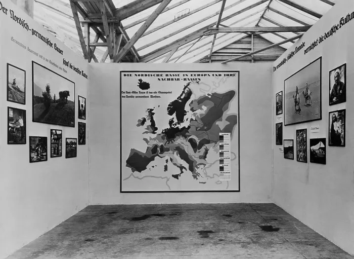 Framed Print : Nazi anti-Semitic propaganda in a 1934 photo exhibit about various European races'. In center is a map identifying racial areas Framed Print : Nazi anti-Semitic propaganda in a 1934 photo exhibit about various European races'. In center is a map identifying racial areas
