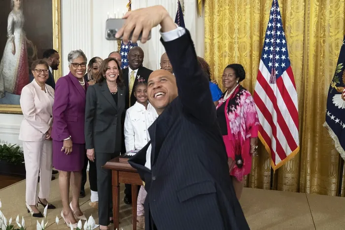 Framed Print : New Jersey Senator Cory Booker takes a group selfie after President Joe Biden signed an executive order for federal policing reforms and police accountability, May 25, 2022