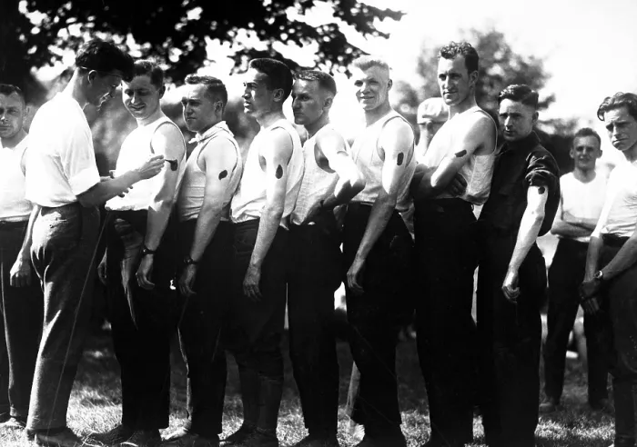 Framed Print : New recruits for the Army's Ambulance Corps are iodined before receiving an inoculation. World War I. Ca. 1917