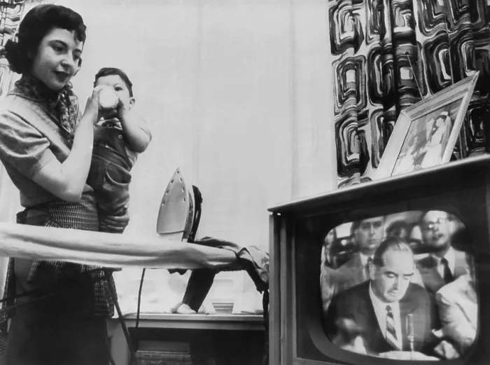 Framed Print : A New York City mother watches a televised Army McCarthy Hearing
