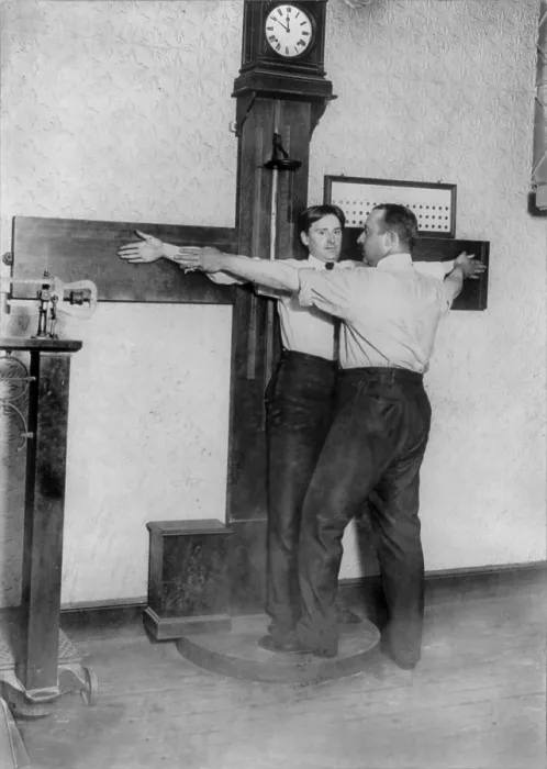 Framed Print : New York City, police department activities, taking bertillon measurements of the armspan, photograph, 1908