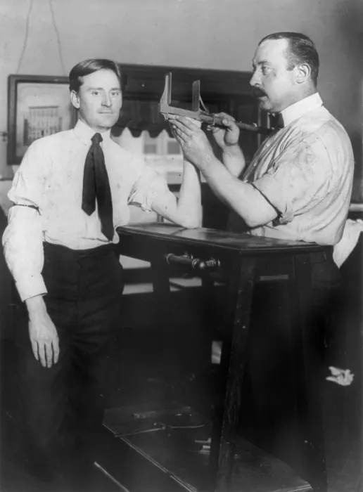 Framed Print : New York City, police department activities, taking bertillon measurements of hand size, photograph, 1908