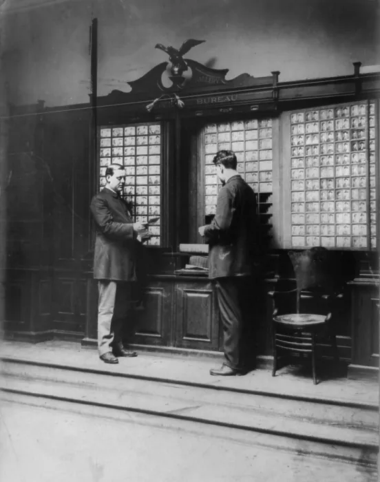 Framed Print : New York City, police department activities, rogues gallery, men looking at mugshot photographs, photograph, 1908