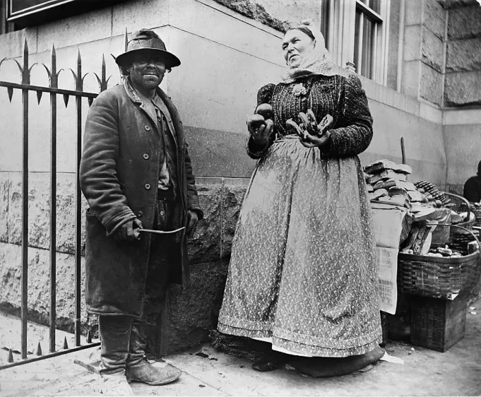 Framed Print : New York City street types: Emigrant man and women pretzel vendor. 1896 photograph by Alice Austen