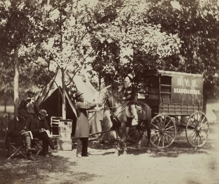 Framed Print : New York Herald Headquarters wagon and reporters in the field during the US Civil War. They are equipped with army tents and a converted ambulance for their horse drawn wagon