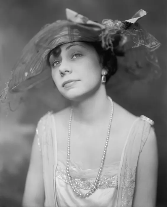 Framed Print : New York Socialite Miss Inez Thomas modeling a hat, long string of pearls, and evening gown. Ca. 1920. (BSLOC_2015_16_245)
