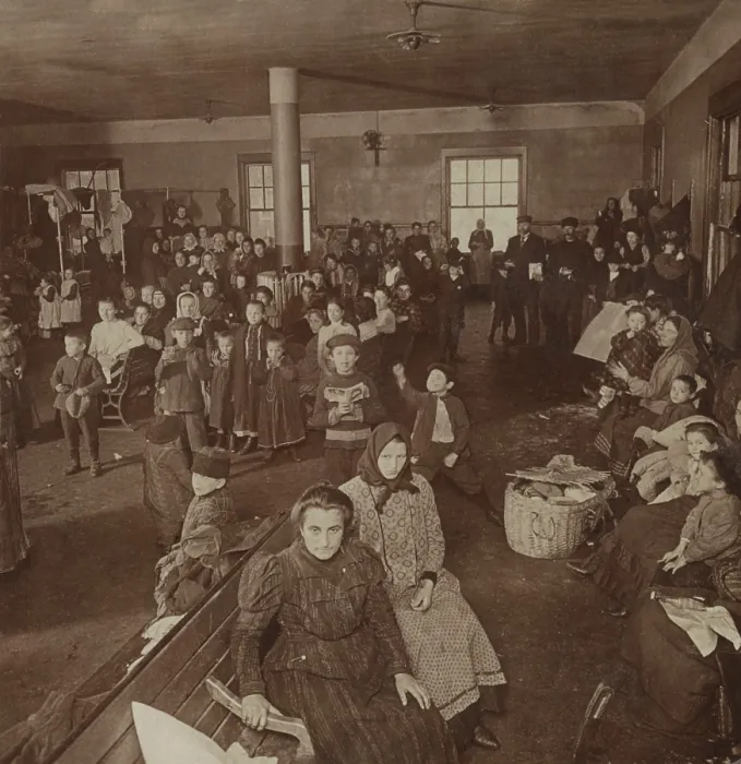 Framed Print : Newly arrived women and children immigrants awaiting examination at Ellis Island, c. 1900-1910 (BSLOC_2018_1_17)