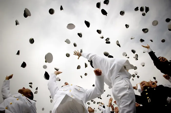 Framed Print : Newly commissioned Navy ensigns and Marine Corps 2nd Lieutenants toss their hats into the air at their 2006 graduation and commissioning ceremony Framed Print : Newly commissioned Navy ensigns and Marine Corps 2nd Lieutenants toss their hats into the air at their 2006 graduation and commissioning ceremony