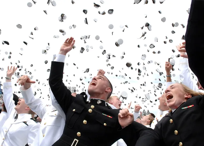 Framed Print : Newly commissioned Navy ensigns and Marine Corps 2nd Lieutenants toss their hats into the air at their 2006 graduation and commissioning ceremony