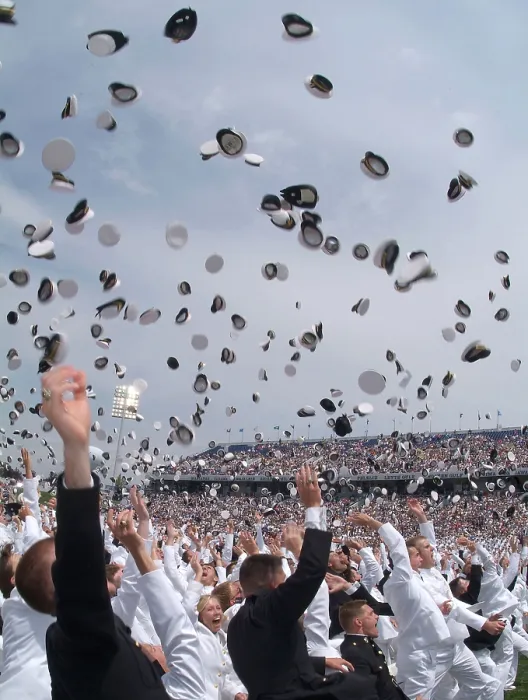 Framed Print : Newly commissioned officers toss their hats into the air at their 2006 graduation and commissioning ceremony. US Naval Academy in Annapolis Maryland. May 26 2006