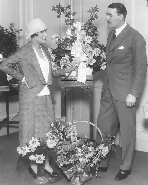 Framed Print : Newly married Gloria Swanson and Marquis de la Falaise, at the Ritz Carlton Hotel in New York City. Many floral pieces greeted her return from France in Nov. 1923 Framed Print : Newly married Gloria Swanson and Marquis de la Falaise, at the Ritz Carlton Hotel in New York City. Many floral pieces greeted her return from France in Nov. 1923