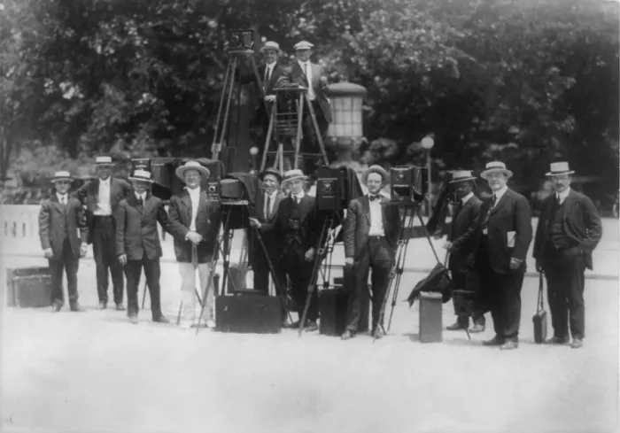 Framed Print : News photographers posing with cameras, circa 1909-1932