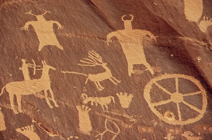 Framed Print : Newspaper Rock Is a large cliff mural of ancient Indian petroglyphs and pictographs. This detail shows a rider on a horse and human figures