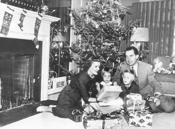 Framed Print : The Nixon family on Christmas Eve: Pat Nixon, Julie Nixon, Tricia Nixon, and Vice President Richard Nixon, Washington DC, December 24, 1953