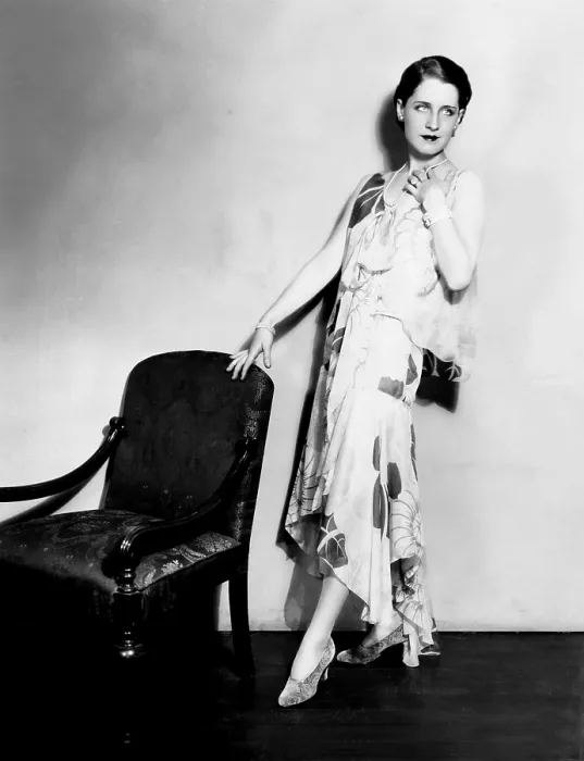 Framed Print : Norma Shearer, modeling a chiffon evening frock with an uneven hemline, 1929