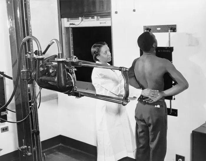 Framed Print : Nurse placing patient in the correct position for taking a chest X-ray for use in the diagnosis of tuberculosis at the Southwest health center in 1937 Framed Print : Nurse placing patient in the correct position for taking a chest X-ray for use in the diagnosis of tuberculosis at the Southwest health center in 1937