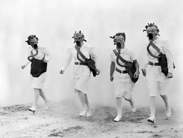Framed Print : Nurses in gas masks walk through a cloud of smoke in a training drill of the U.S. Army Air Forces Technical Training Command, 1942