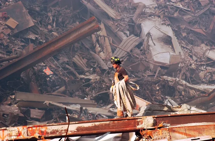Framed Print : NYC Fire fighter carries a fire hose over smouldering fires and wreckage at Ground Zero, Sept. 18, 2001 Framed Print : NYC Fire fighter carries a fire hose over smouldering fires and wreckage at Ground Zero, Sept. 18, 2001