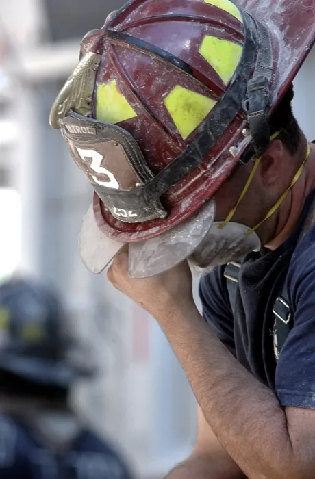 Framed Print : NYC Fireman takes a break during the rescue operations on Sept. 14, 2001