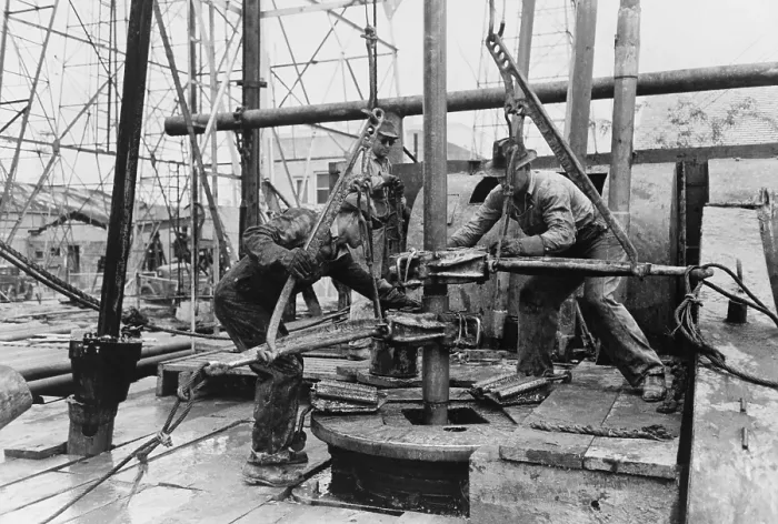Framed Print : Oil rig workers, called roughnecks, at work, loosening sections of pipe on an drilling platform, Kilgore, Texas. 1939 Photo by Russell Lee