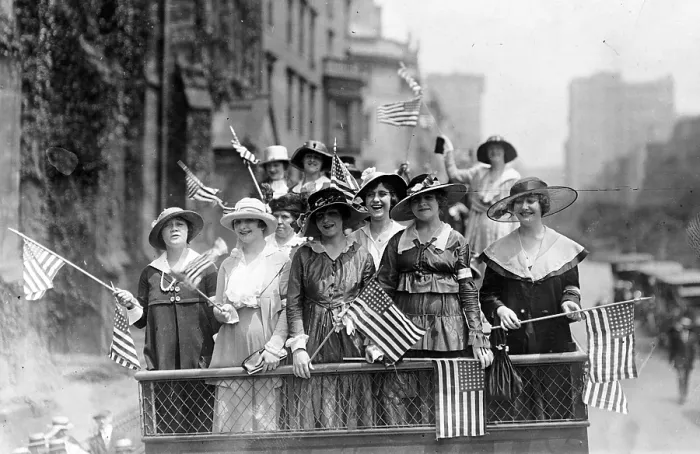 Framed Print : Old Glory. Group of women standing on top of vehicle waving flags, New York City, ca. 1907-1916