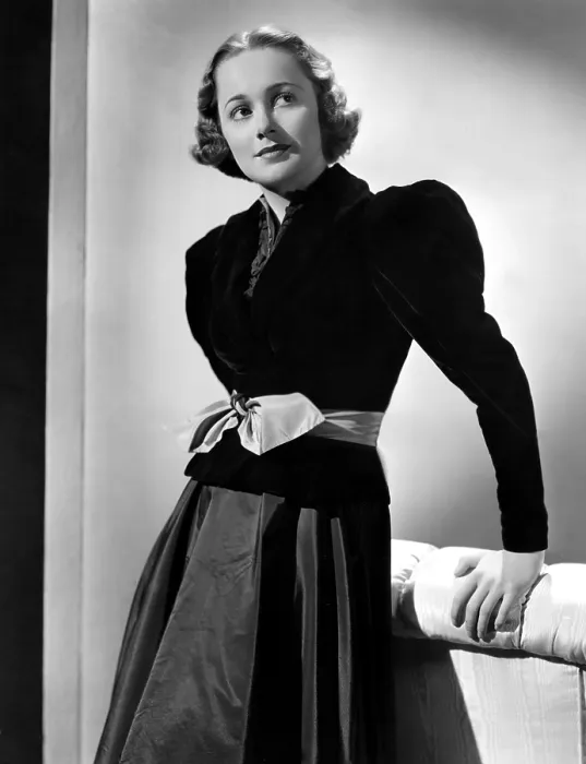 Framed Print : Olivia De Havilland in black velvet jacket, 1937