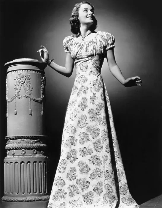 Framed Print : Olivia De Havilland, modeling a youthful summer formal, 1939 Framed Print : Olivia De Havilland, modeling a youthful summer formal, 1939