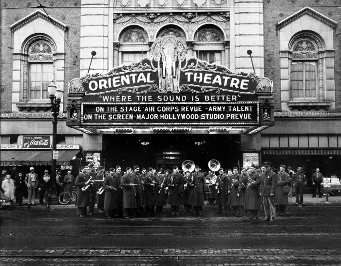 Framed Print : The Oriental Theatre exterior with brass band, marquee reads: Where the Sound is Better