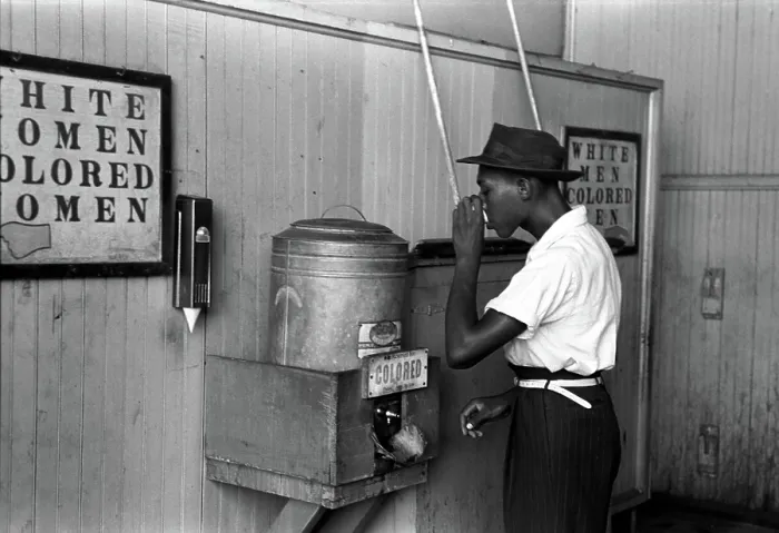 Framed Print : Original caption reads: Negro drinking at colored water cooler in streetcar terminal, by Lee Russell, Oklahoma City, Oklahoma, July, 1939 Framed Print : Original caption reads: Negro drinking at colored water cooler in streetcar terminal, by Lee Russell, Oklahoma City, Oklahoma, July, 1939