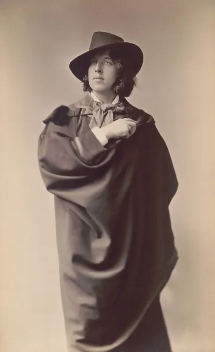 Framed Print : Oscar Wilde, Anglo-Irish playwright and poet in studio portrait by Napoleon Sarony, 1882. Wilde stands with a cape draped dramatically over his body (BSLOC_2016_11_185)