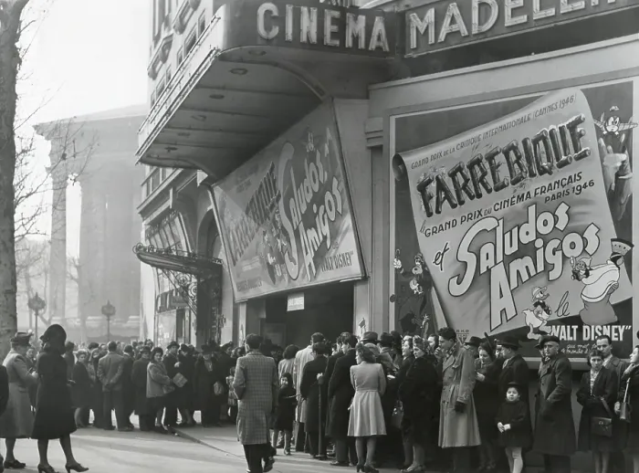 Framed Print : Parisiennes at a movie theater showing the Disney film, Saludos Amigos in April 1947. At the Madeleine Cinema, Boulevard des Capucines, Paris. - (BSLOC_2014_17_126) Framed Print : Parisiennes at a movie theater showing the Disney film, Saludos Amigos in April 1947. At the Madeleine Cinema, Boulevard des Capucines, Paris. - (BSLOC_2014_17_126)