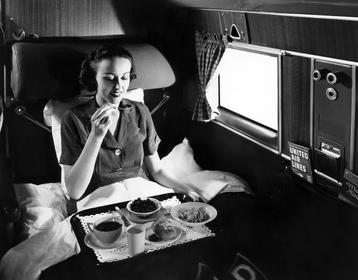 Framed Print : A passenger eats breakfast on United Airline's Douglas Mainliner Sleeper airplane from Chicago to San Francisco, 1937. Courtesy: CSU Archives / Everett Collection Framed Print : A passenger eats breakfast on United Airline's Douglas Mainliner Sleeper airplane from Chicago to San Francisco, 1937. Courtesy: CSU Archives / Everett Collection